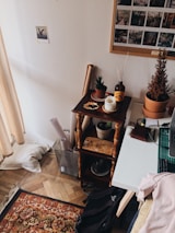 A cozy corner of a room with multiple styles of compact storage boxes arranged neatly.