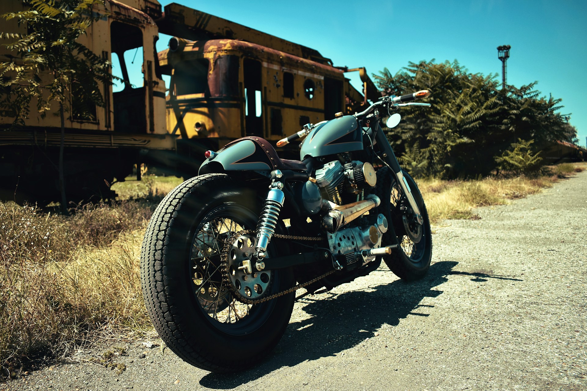 a motorcycle parked in front of a train