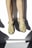 A pair of feet wearing worn sandals in a beige or tan color. The sandals have multiple straps and are slightly scuffed, suggesting frequent use. Shadows are cast on the light background, creating a high-contrast effect.