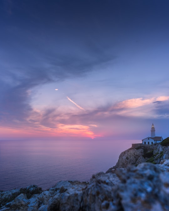 view of lighthouse atop of mountain in Capdepera Spain