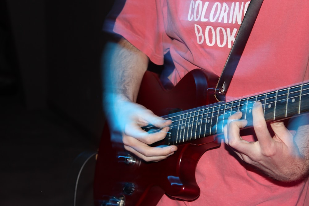 man playing electric guitar