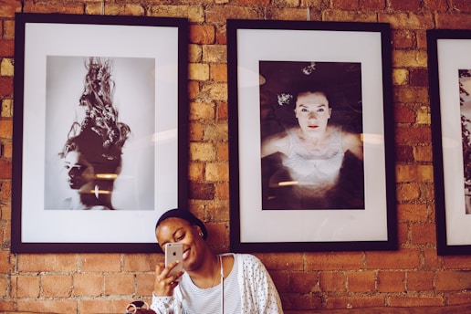 A candid shot of a college girl sitting comfortably in a cozy dorm bathroom, capturing a natural moment.