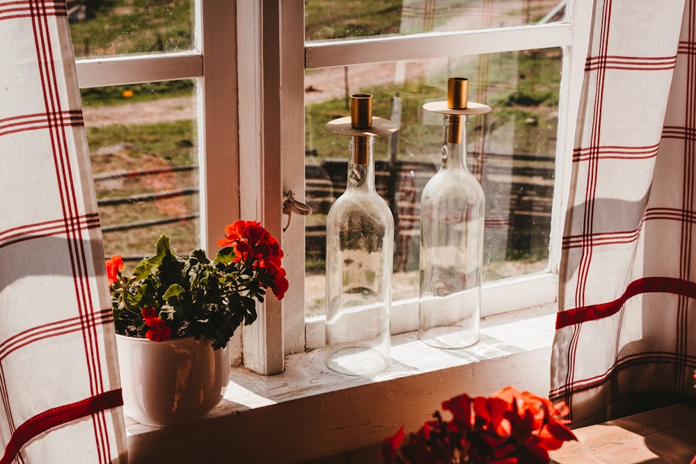clear bottles on window