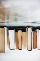 low angle photography of pile of books