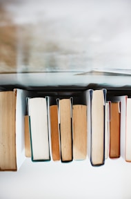 low angle photography of pile of books