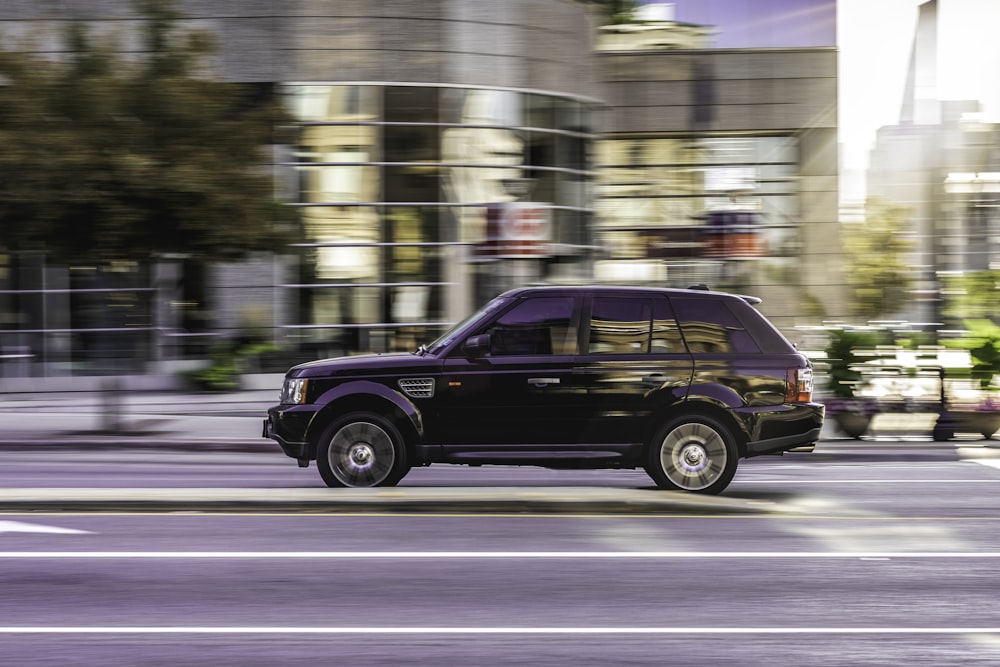 black suv on road during daytime