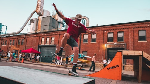 A lively streetboard competition with riders performing tricks on urban ramps.