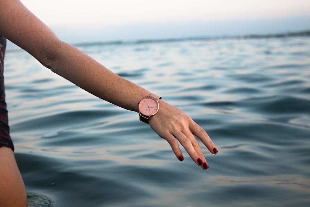 round silver-colored analog watch