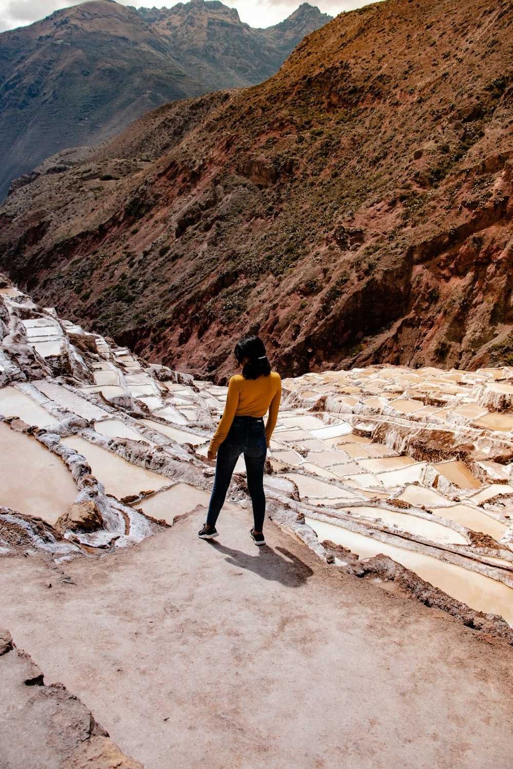 woman standing on hill