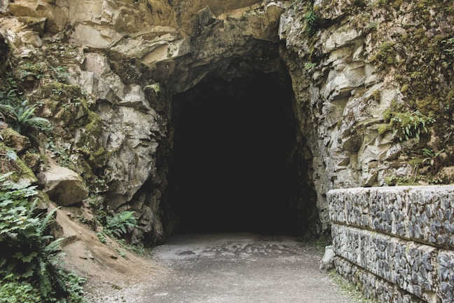 A mysterious cave entrance symbolizing the adventure of crypto hunting.
