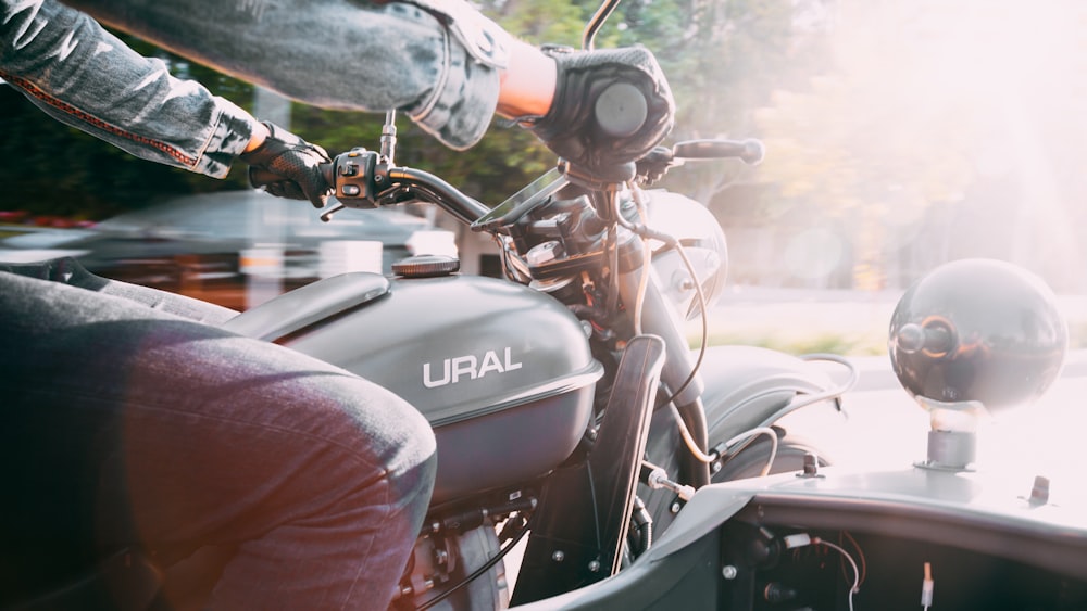 person riding on Ural tricycle