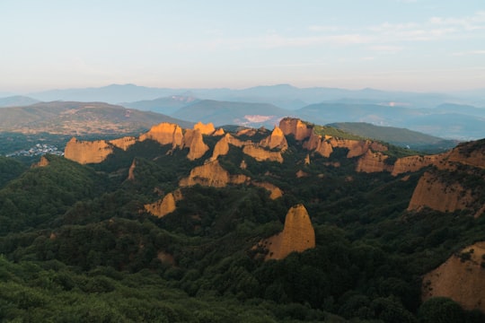 brown mountains and green leafed trees in Mirador de Orellán Spain