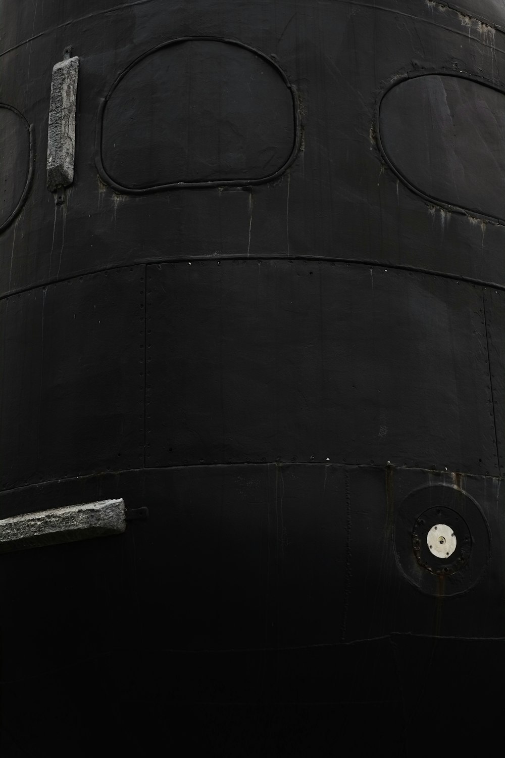 a close up of the side of a large black object