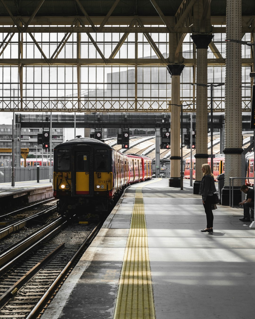 Woman waiting for her train in Waterloo London