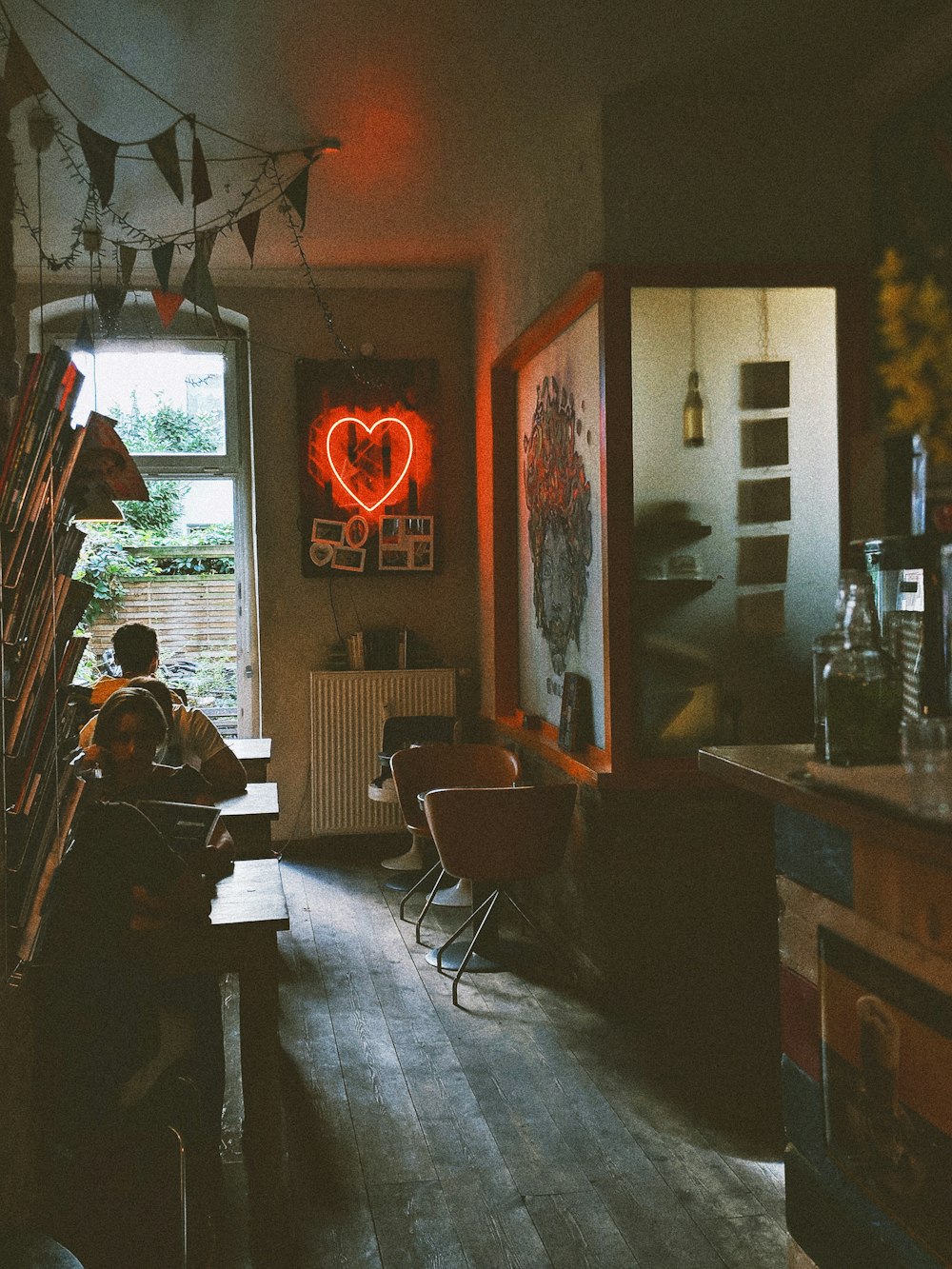 sitting people on wooden chair in room