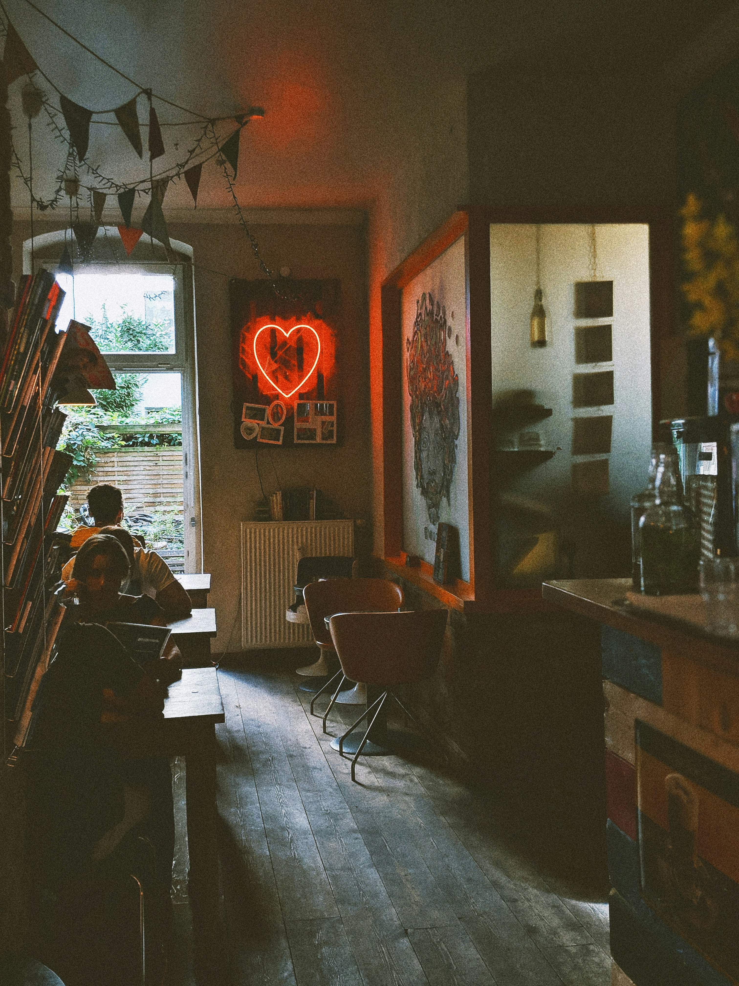 sitting people on wooden chair in room