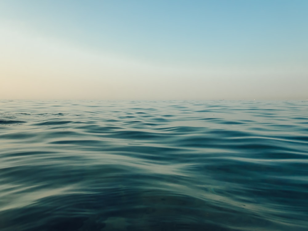 calm water of ocean during daytime