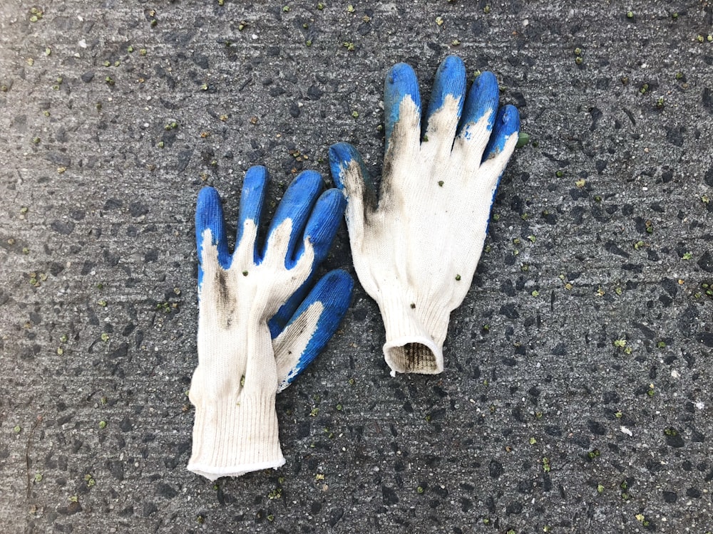 pair of white gloves on white surface