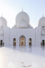 white mosque under gray sky during daytime