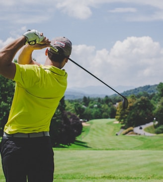 man playing golf during daytime