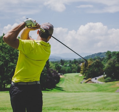 man playing golf during daytime