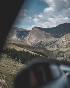 A scenic mountain landscape representing adventure travel options.