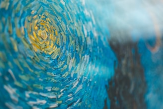 A sweeping canvas filled with bold blues and dynamic shapes conveying movement.