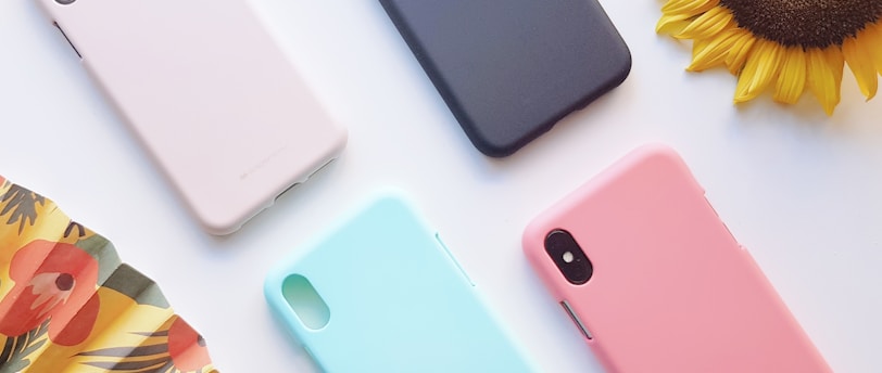 four assorted-color iPhone X cases