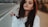 woman in white sweater taking selfie