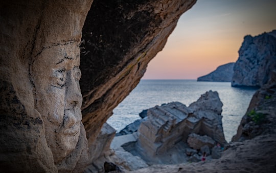 brown cliff near sea in Ibiza Spain