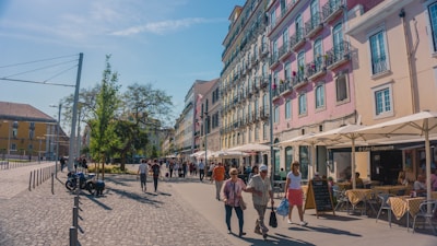 A vibrant street scene in Italy showing locals chatting and laughing.