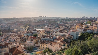 A dynamic cityscape blending Spanish and South American architectural styles under a clear blue sky.