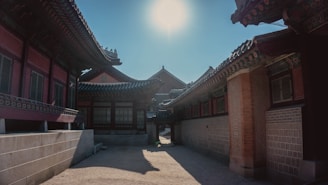 A serene temple courtyard bathed in soft morning light, with delicate shadows playing on traditional Korean architecture.