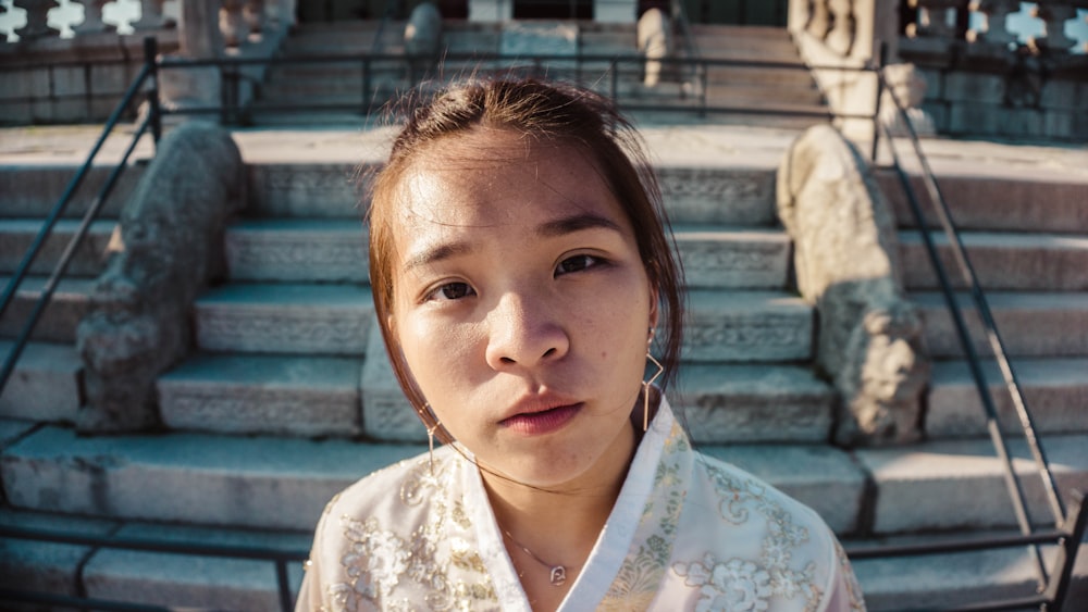 woman standing on concrete stair