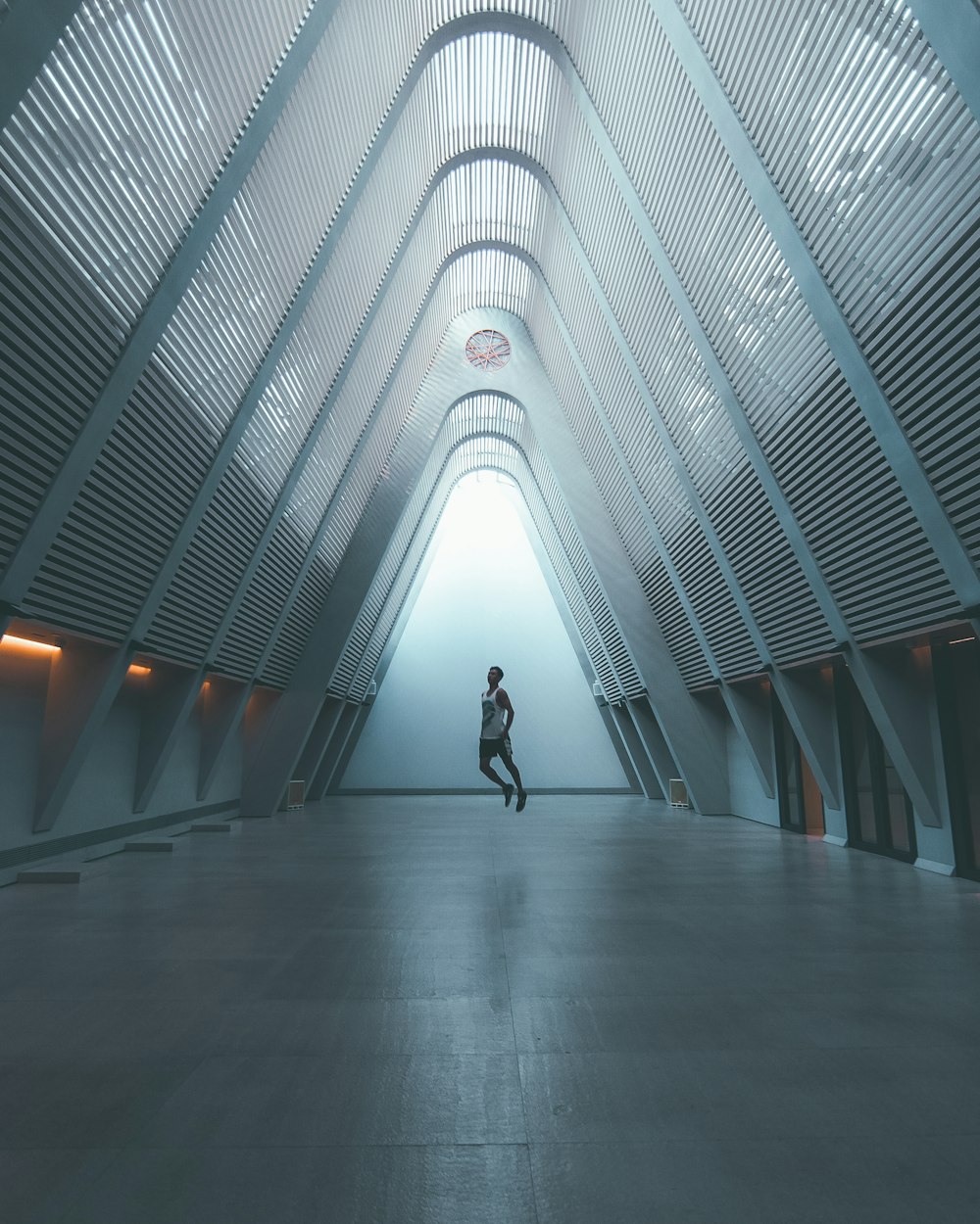 person standing inside gray metal structure