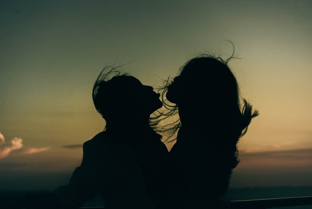 silhouette photograph of two girls