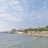 A calm coastal landscape symbolizing community and regional development.