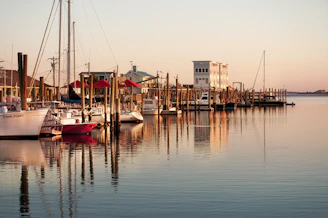 A serene marina scene with boats ready to sail after maintenance.
