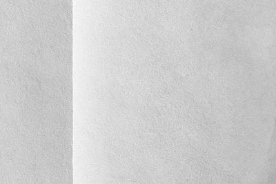 Close-up of a smooth wallpaper seam in a bright office space, highlighting precision and care.