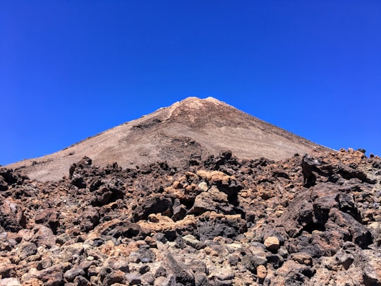 brown rocky mountain under clear sky in Teide National Park Spain
