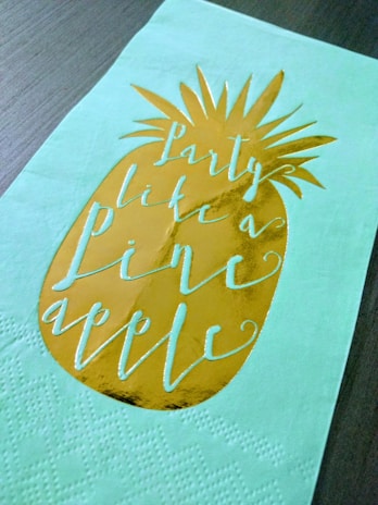 A creative design featuring a pineapple holding a protest sign.