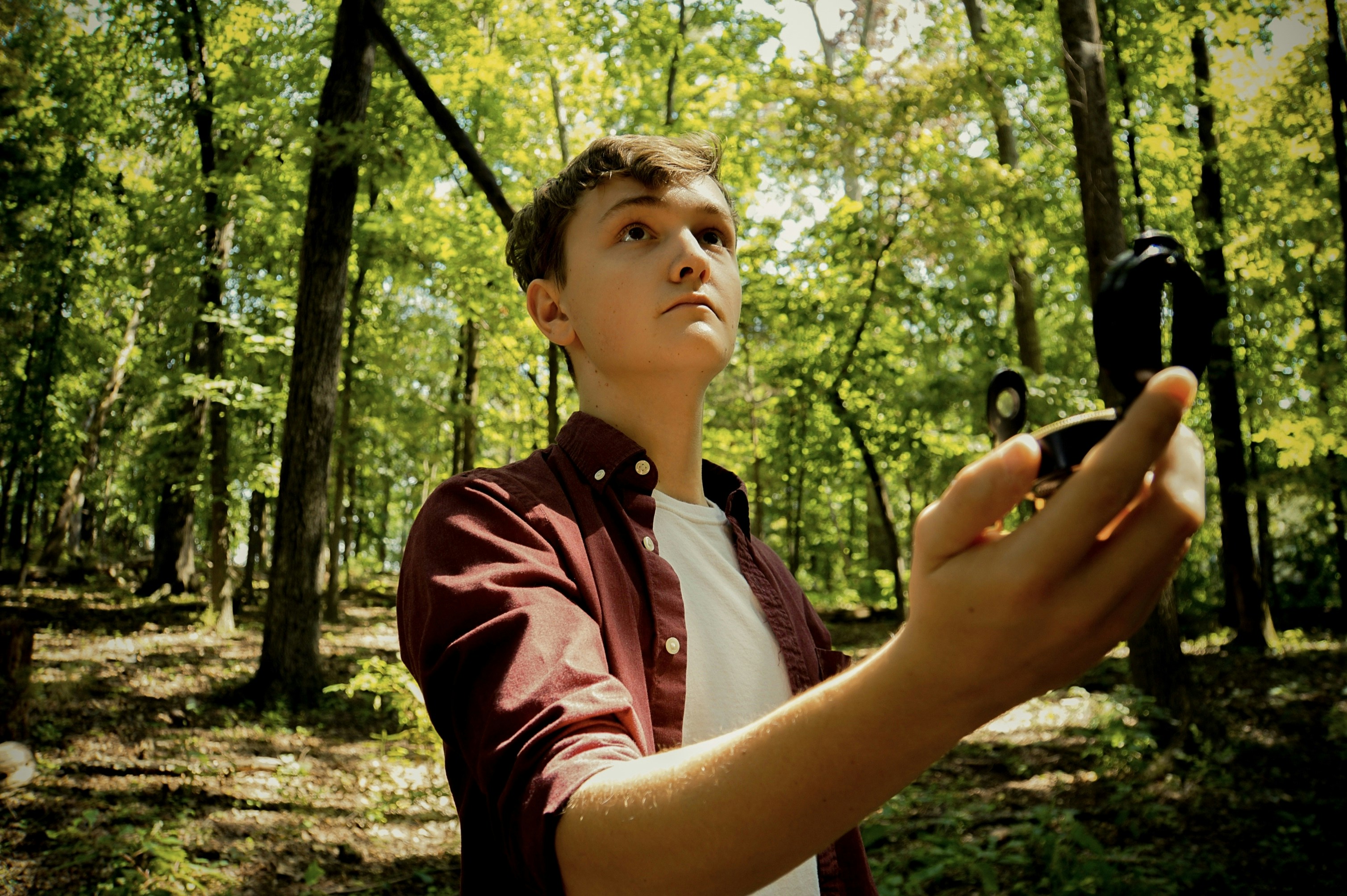 "This photo has some deep meaning for me, it may look like I\u2019m lost in the woodes but I have a connection with the compass in my hand. See I come from a rough family, they don\u2019t always do what is moral or right. But I try to be different. so I\u2019m always trying to find the right way to go, hence the compass."