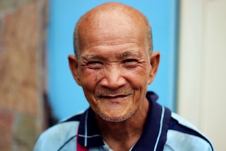smiling man with polo shirt