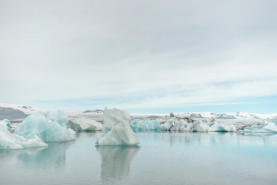 A serene iceberg glowing under the soft Antarctic sunset