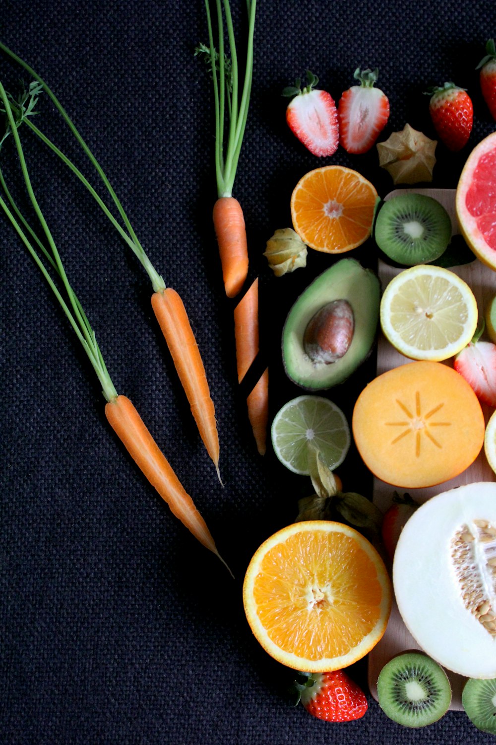 sliced vegetable and fruits on board