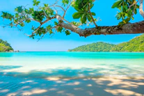 ocean surrounded by island under blue sky