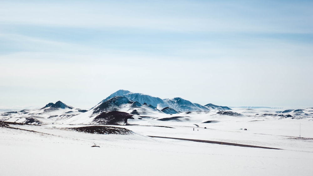 snow-covered land during day time