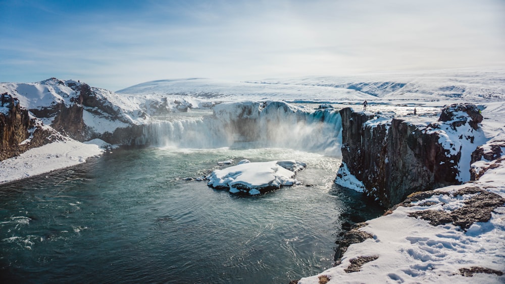 waterfall covered with snow at daytime