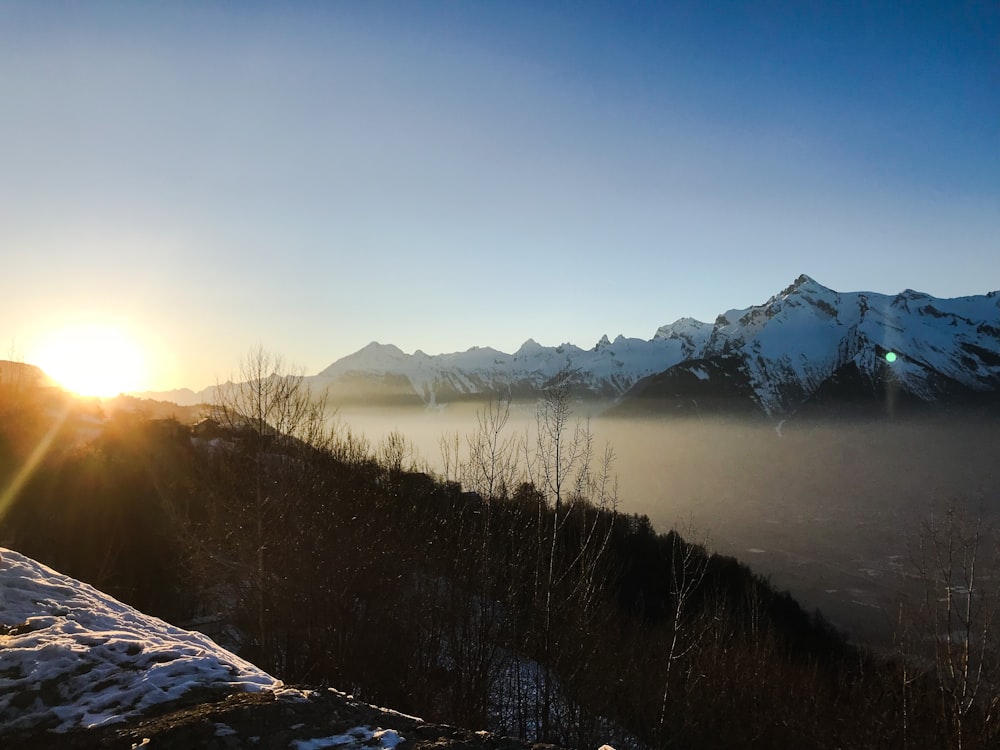 snow covered mountains under clear sky