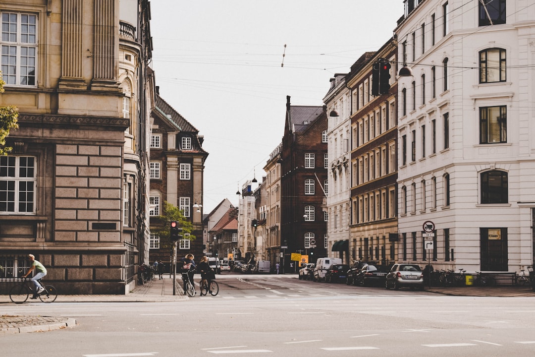 man cycling through street,
